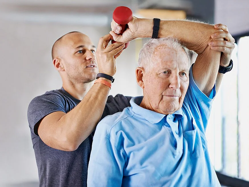 Fitness banner, dumbbell or physiotherapist with senior man in arm exercise or body recovery workout. Coach, double exposure mockup space or mature client stretching or training in physical therapy Shot of a physiotherapist helping a senior man with weights
